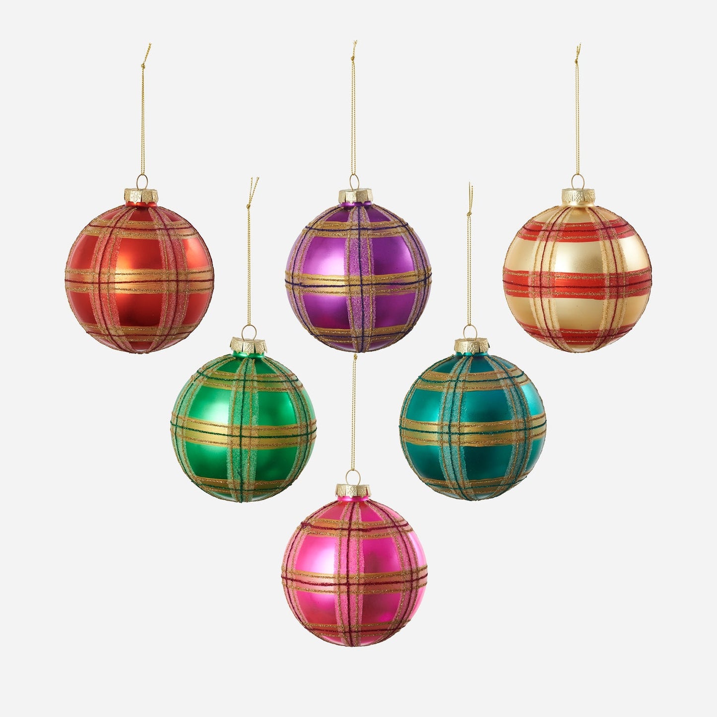 Set of colorful plaid Christmas ornaments on a white background