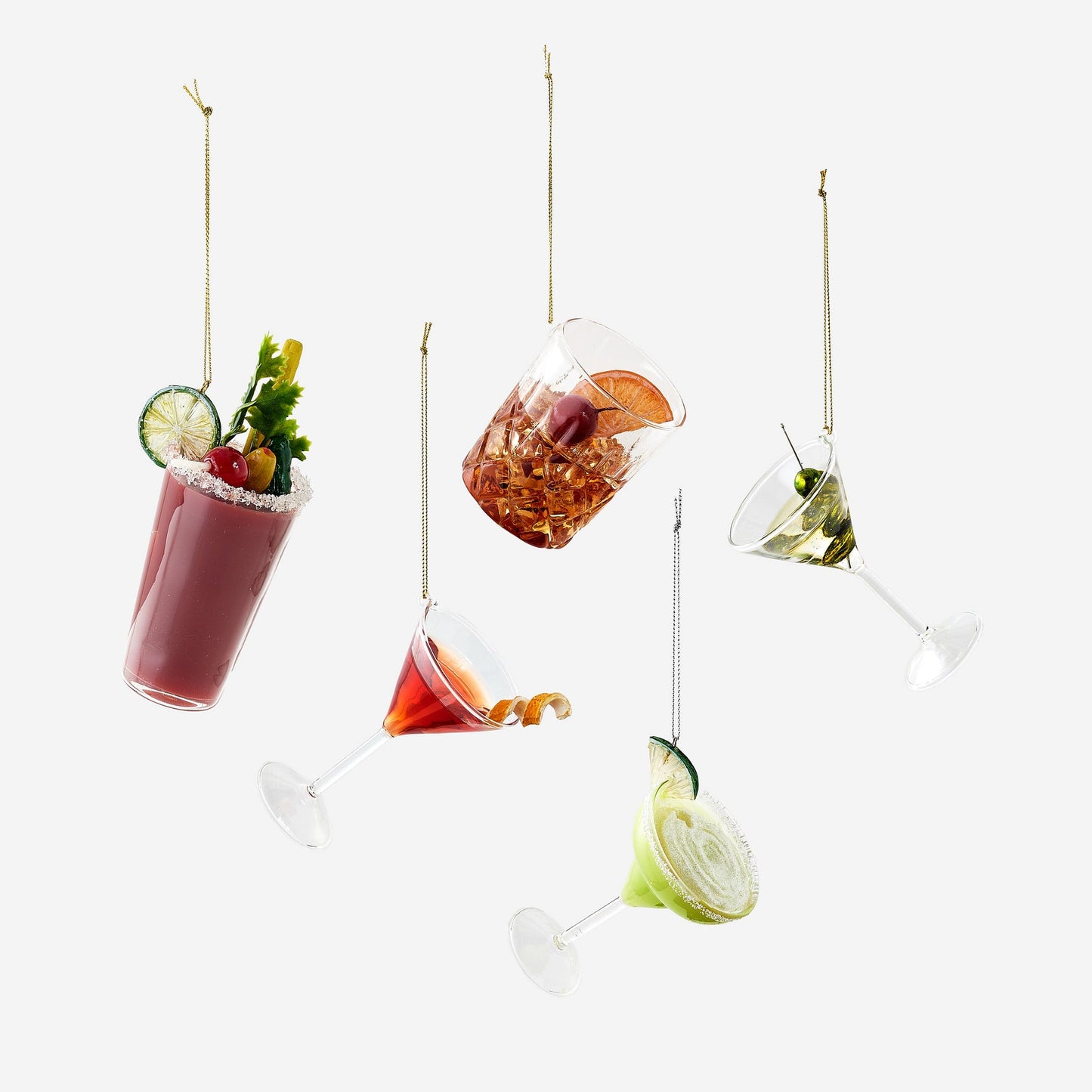 Hanging cocktails with garnishes on a white background