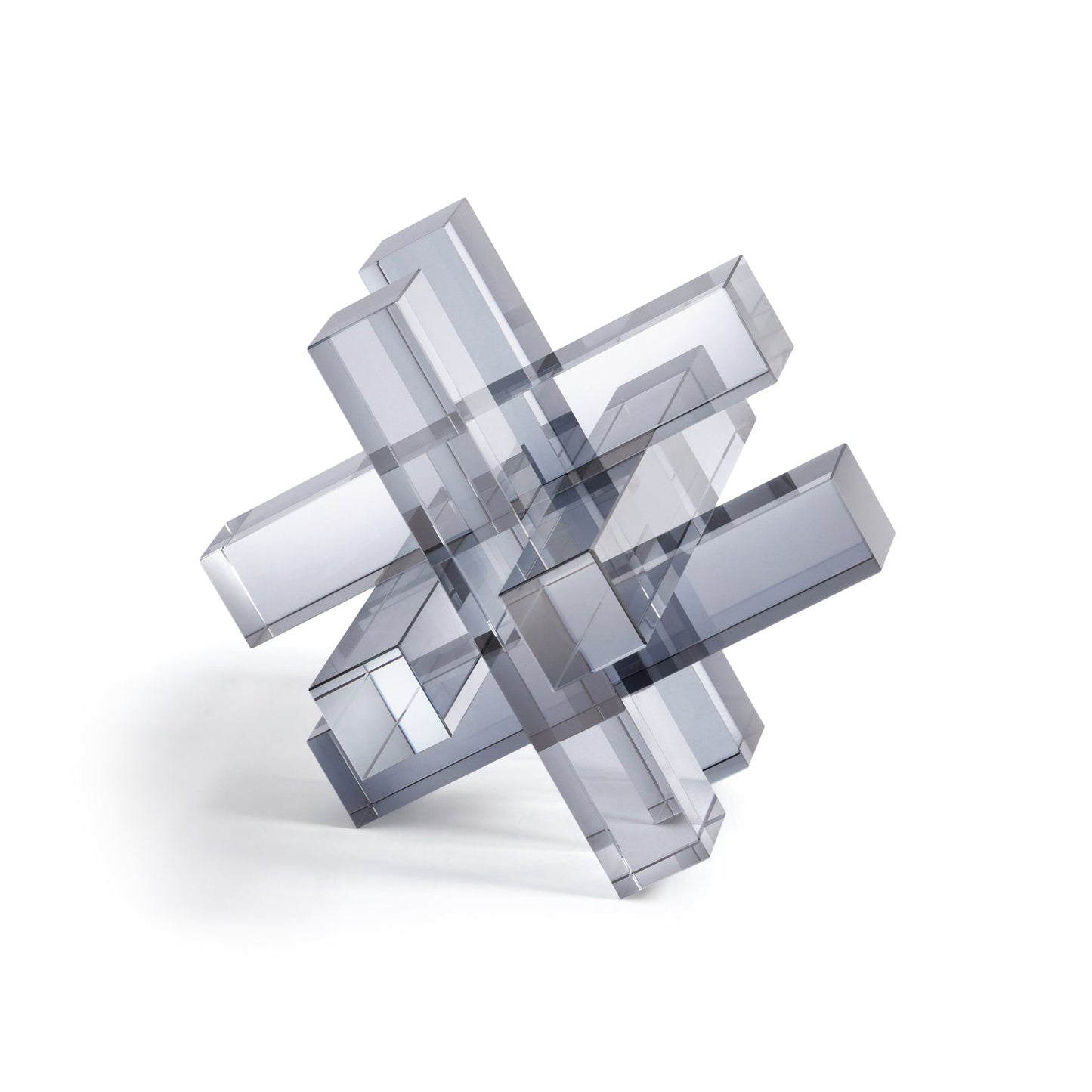 Geometric glass sculpture on a white background