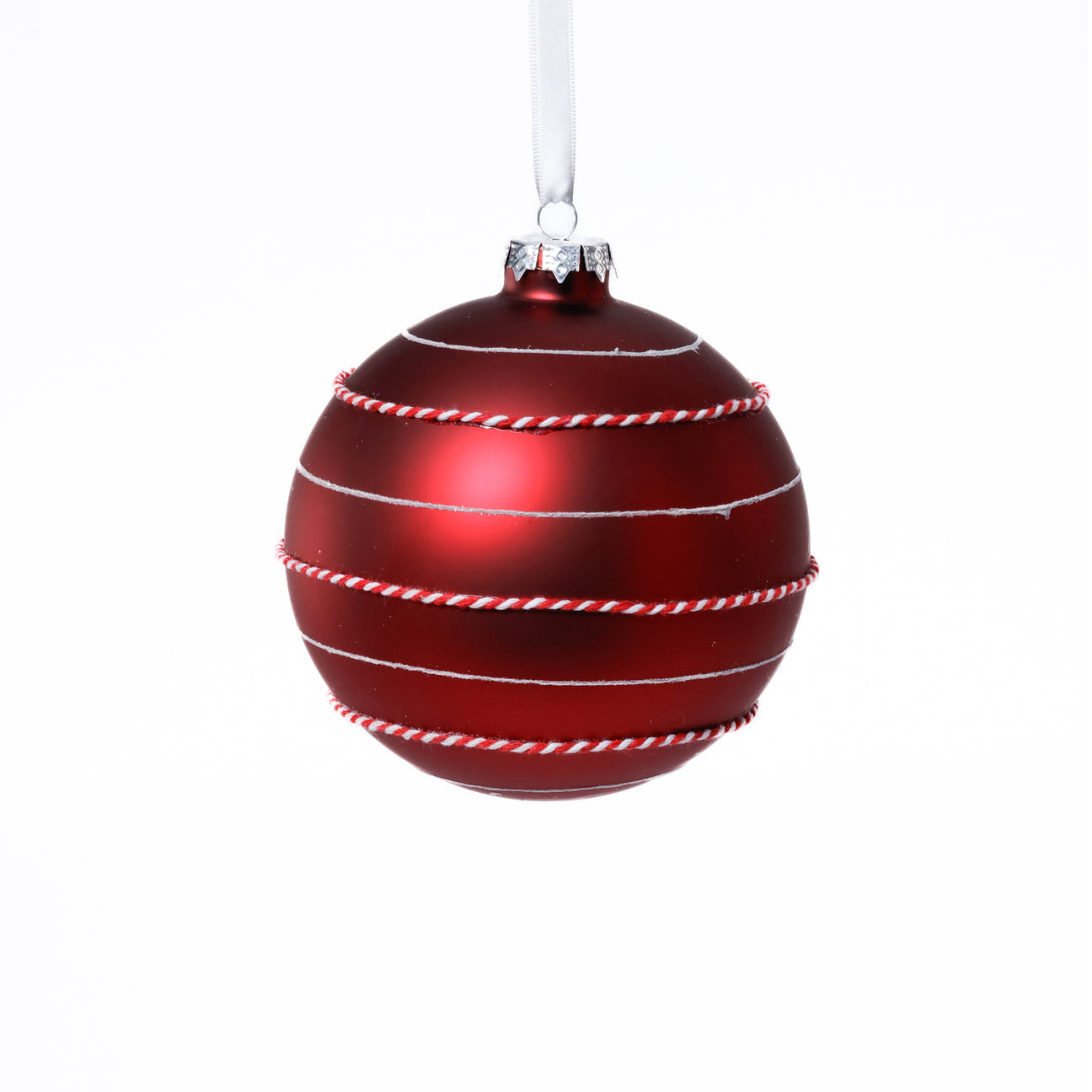 Red Christmas ornament with white stripes on a white background