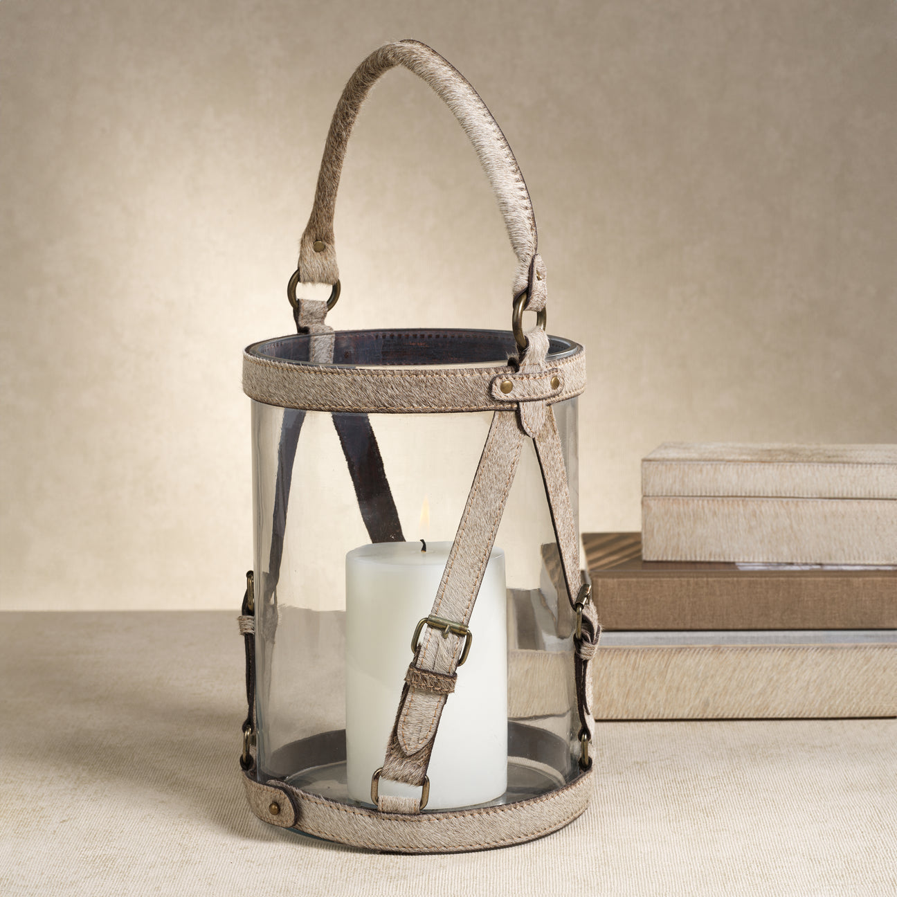 Decorative lantern with a candle inside on a neutral background