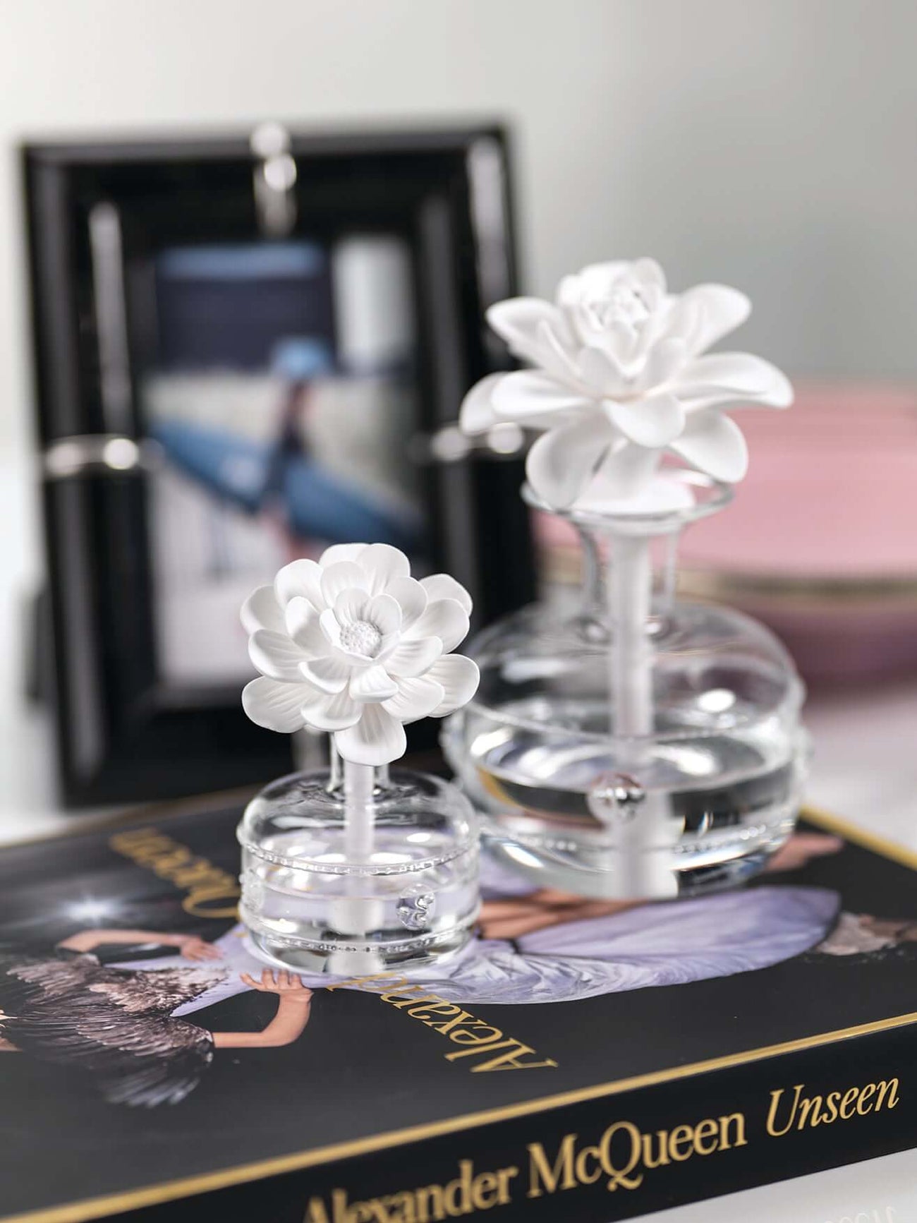 Elegant glass diffusers from the Grand Casablanca Diffuser Collection with floral designs.