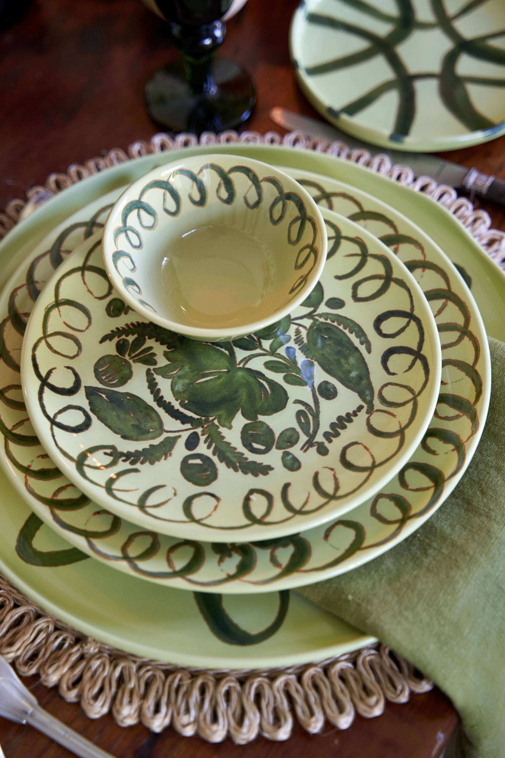 Amalfi Dessert Plate Lime - 9.1" Diameter displayed with ceramic bowl on a rustic wooden table.