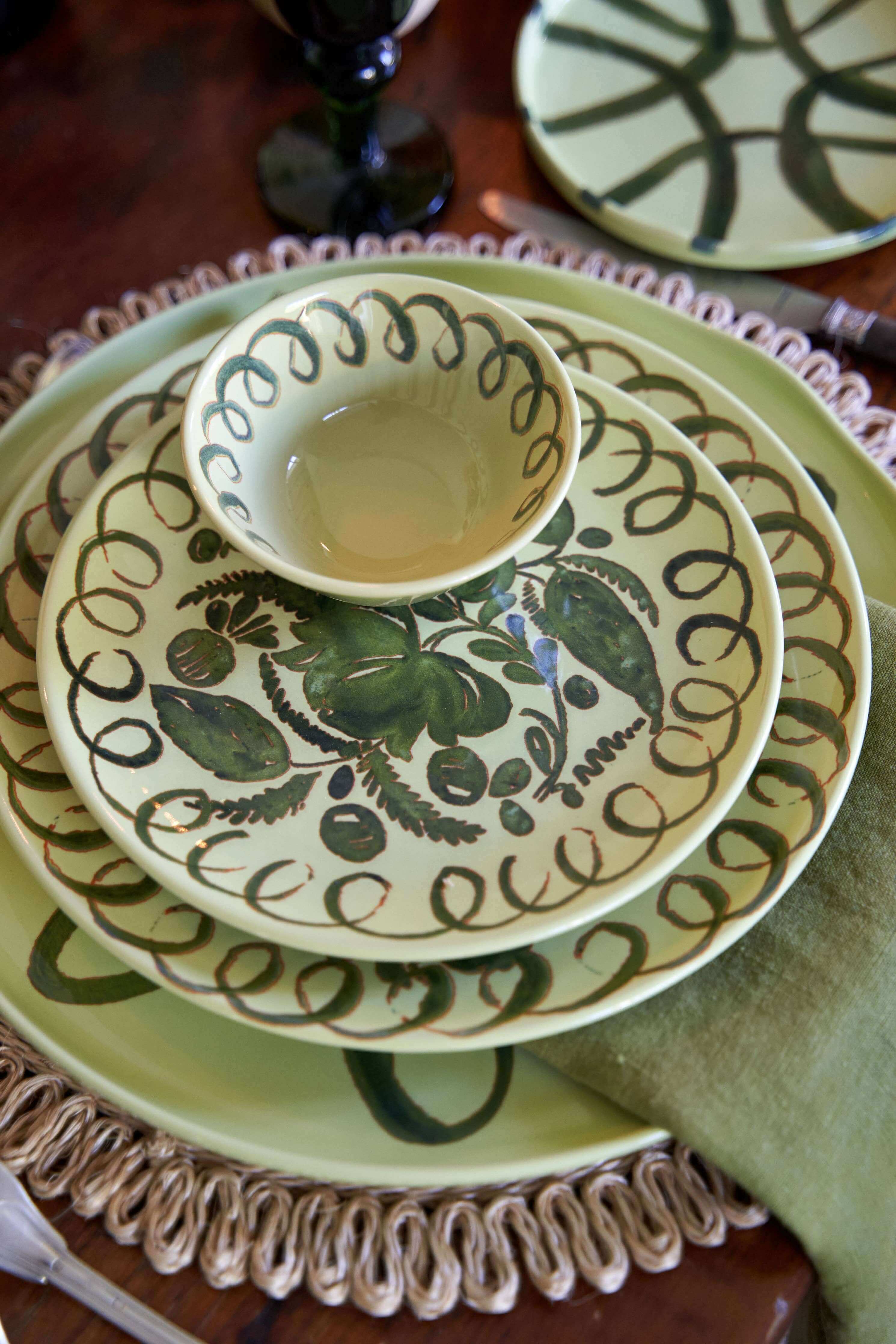 Amalfi Dessert Plate Lime - 9.1" Diameter displayed with ceramic bowl on a rustic wooden table.