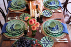 Beautifully arranged Amalfi Dessert Plate Green - 9.1" Diameter on a rustic wooden dining table with seasonal decor.