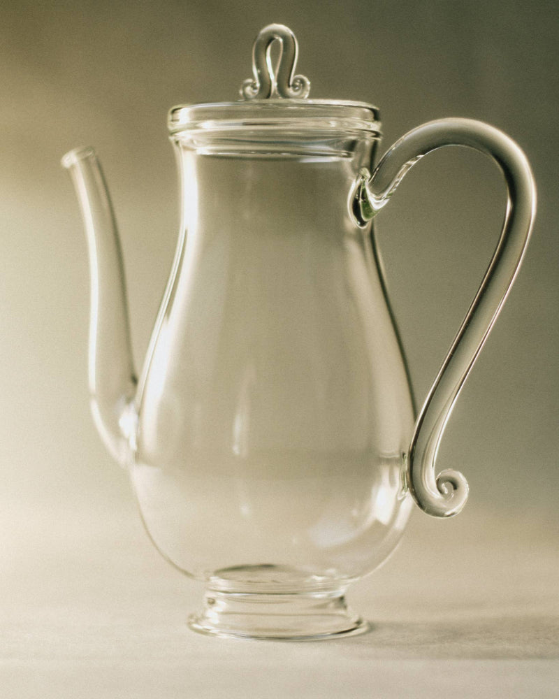 Glass Bell Pot, Clear designed for coffee and tea, featuring a feminine silhouette and curling details.