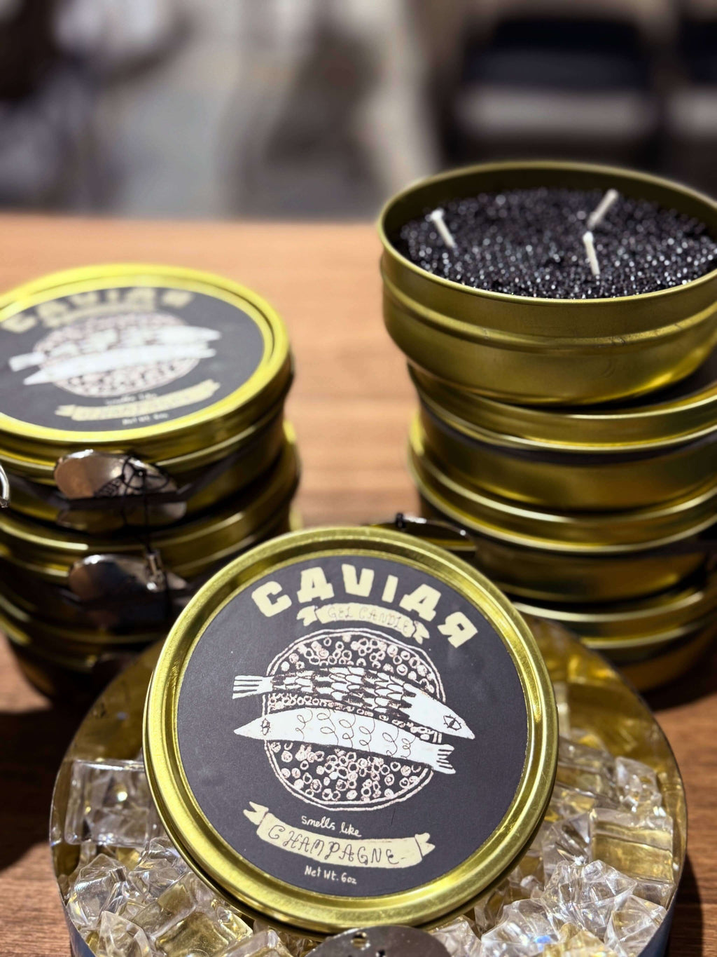 Fancy Caviar Candle in a decorative tin, showcasing realistic caviar gel wax with a champagne scent.