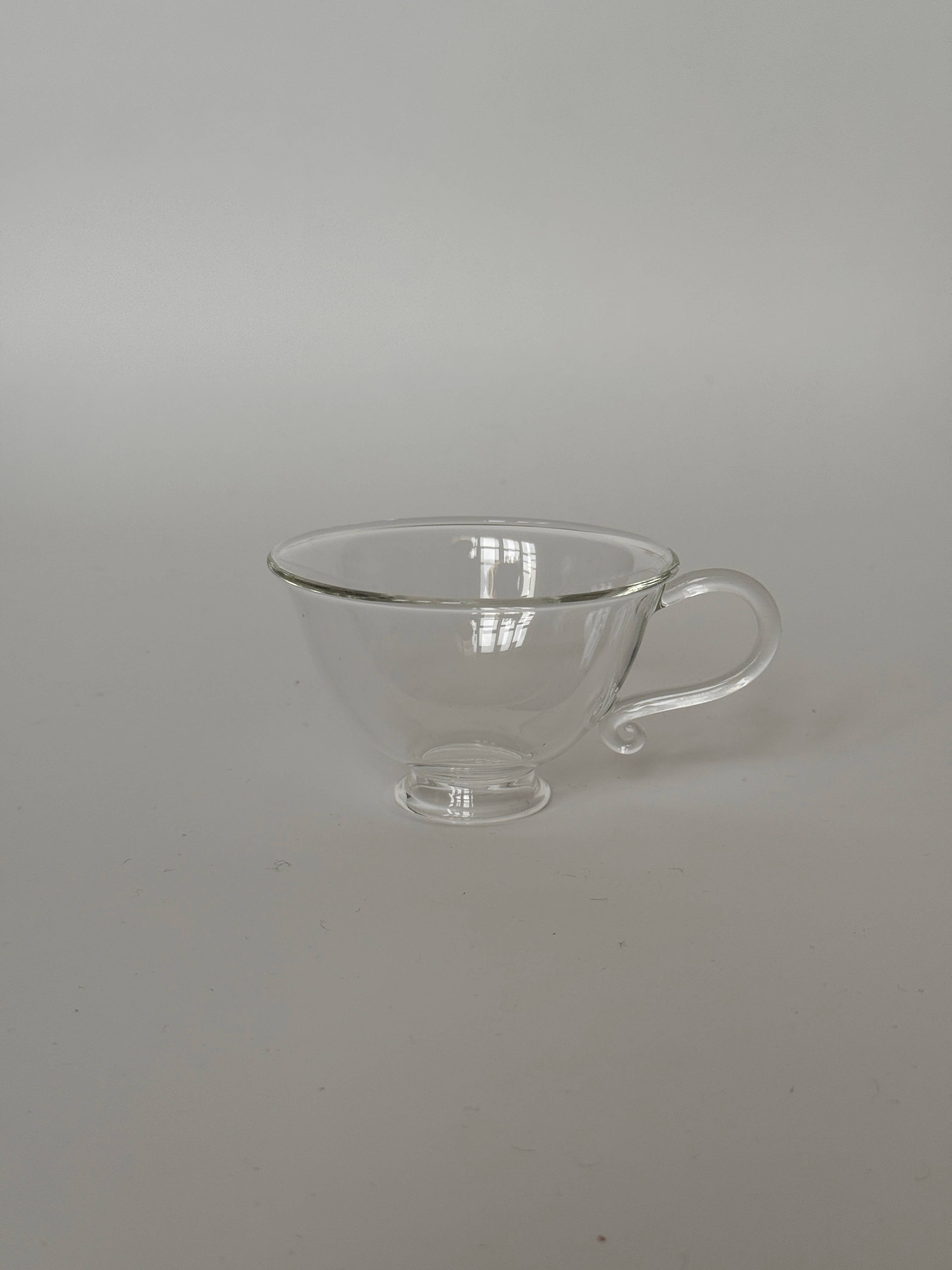 Image of a Petite Tasse, Clear (Set of 2), showcasing its elegant design and curvy silhouette.