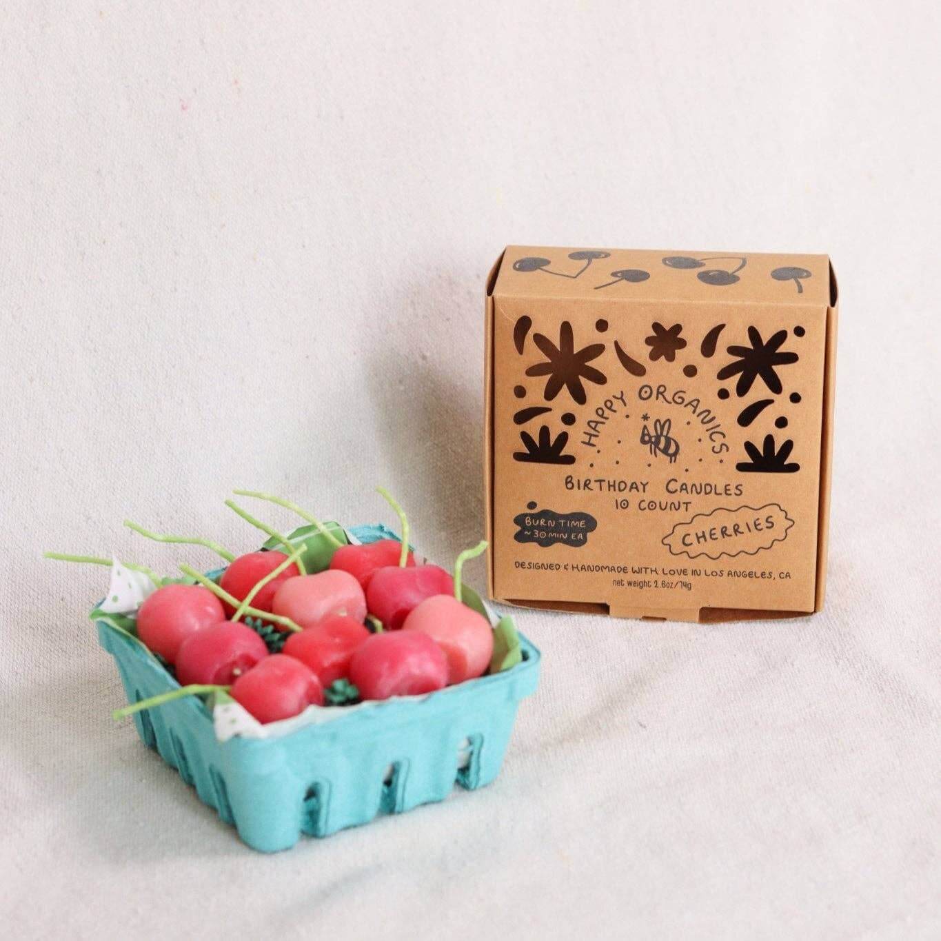 Pink Cherry Birthday Beeswax Candles in a teal basket with packaging, perfect for celebrations and special events.