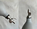 Tall Handmade Ceramic Oil Bottle with polished pourer and matte glaze finish.