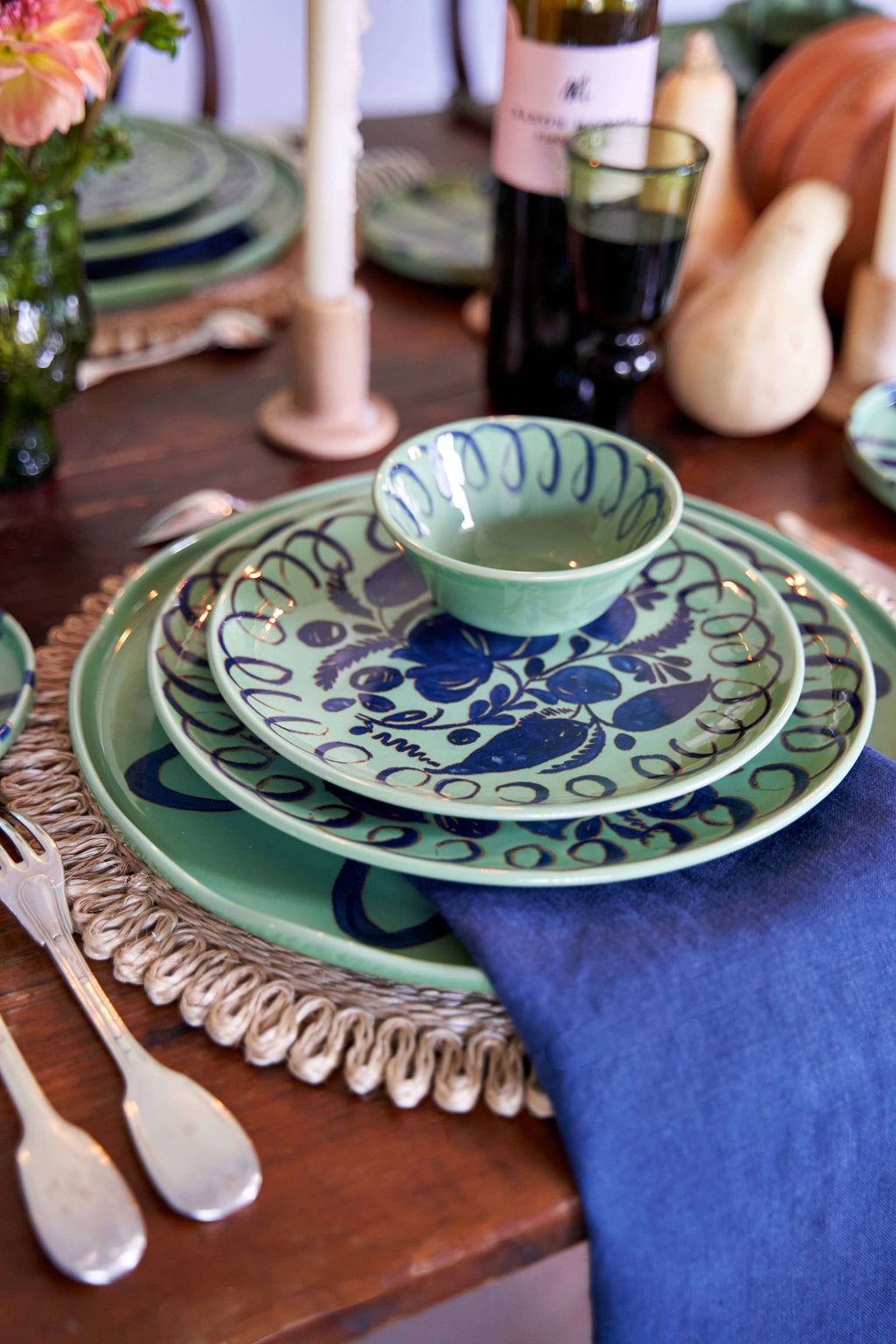 Amalfi Dessert Plate Green - 9.1" Diameter with blue patterned bowl and napkin on a rustic table setting.