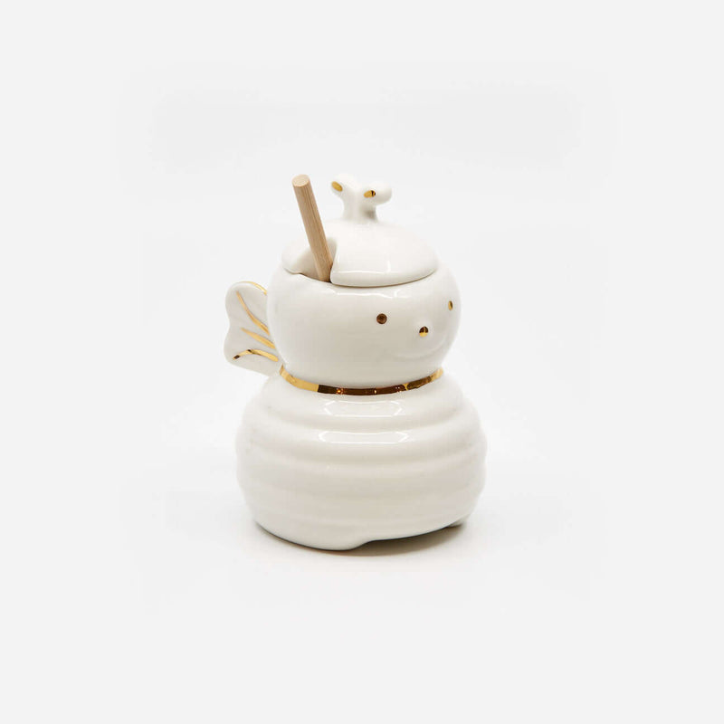 Honey Bee Jar w/Dipper, porcelain honey jar shaped like a bee with gold accents and wooden dipper.