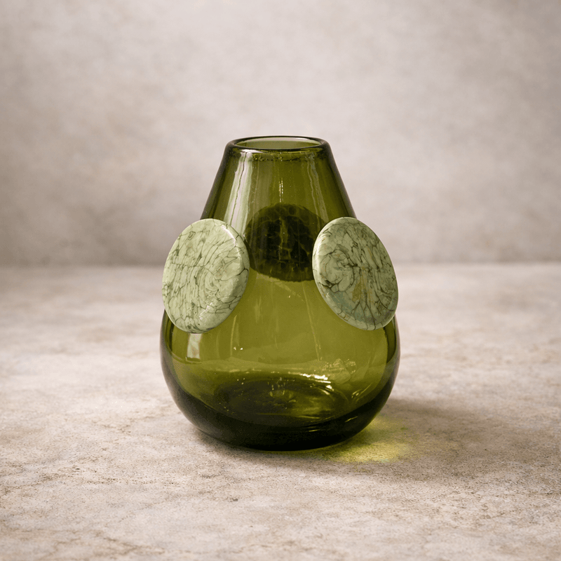 Ojo De Libre Vase handcrafted from recycled glass with jade-like medallions in forest green.