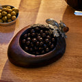 acorn nut bowl with chocolate covered nuts inside
