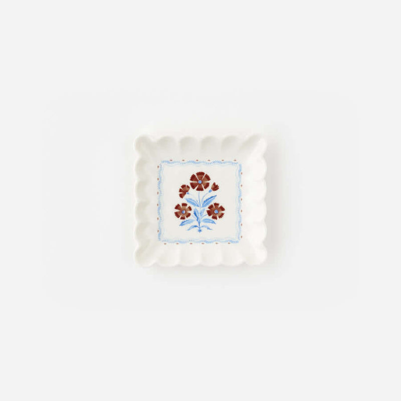 Jardin Floral Porcelain Plate - Set of 2, scalloped-edge plate with red carnations and blue stems.
