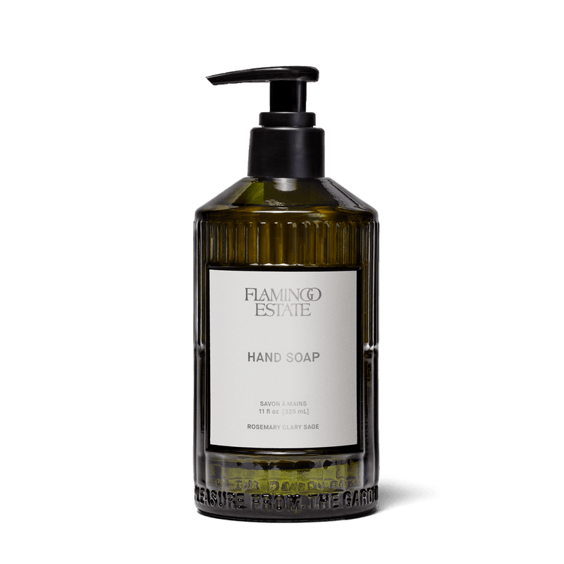 Flamingo Estate Rosemary Clary Sage Glass Hand Soap in translucent green glass bottle with pump.