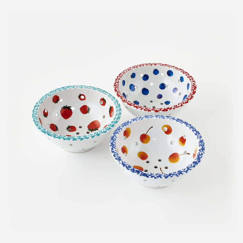 Set of 3 Assorted Berry Bowls with hand-painted fruit designs in various colors and perforated for draining.