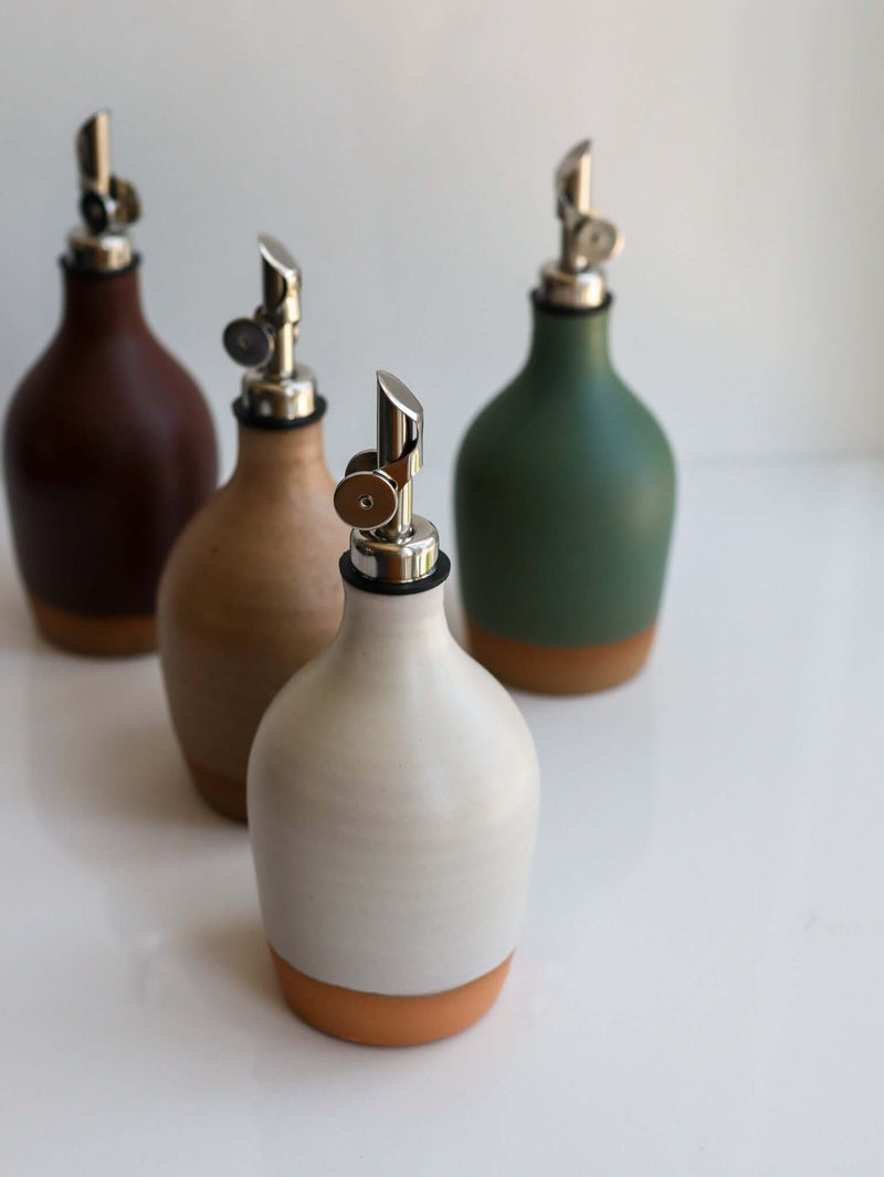Handmade Ceramic Oil Bottle collection featuring matte glazes and polished pourers, perfect for kitchen use.