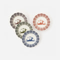Pumpkin Scalloped Plates, Set of 4 featuring illustrated pumpkins and scalloped edges in four colors.