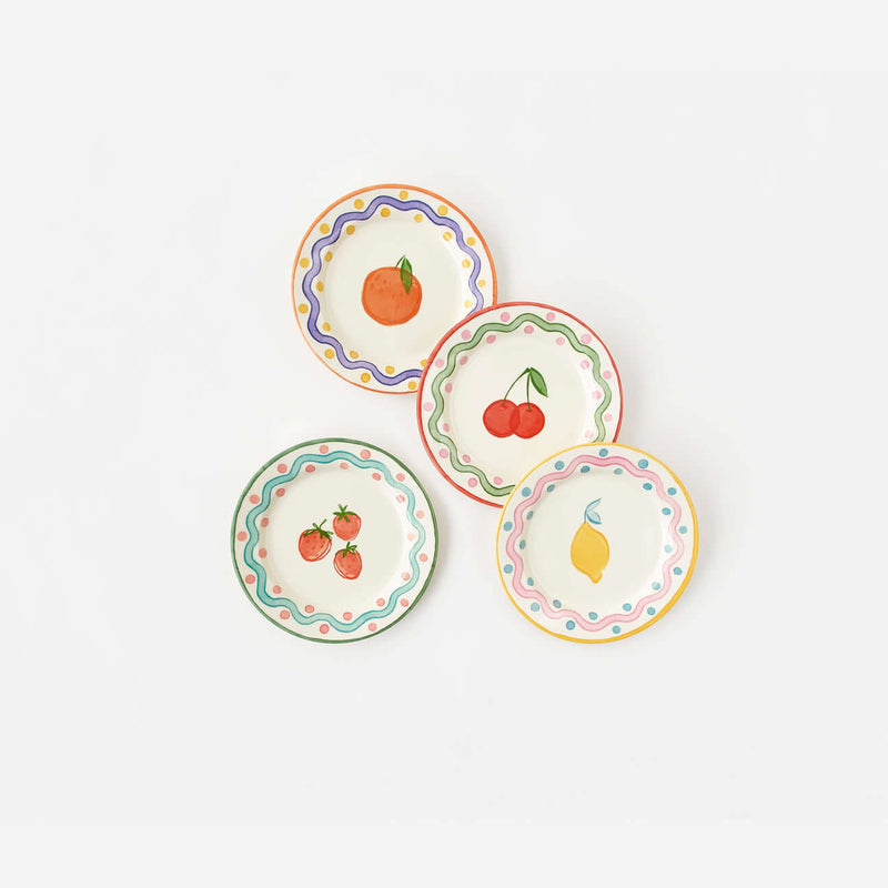 Terrazzo "Enamel" Fruit Plate, Set of 4 in colorful designs featuring fruits like orange, cherries, strawberries, and lemon.