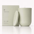 Lily + Lime Candle in matte green container with box, featuring fresh citrus scent and organic materials.