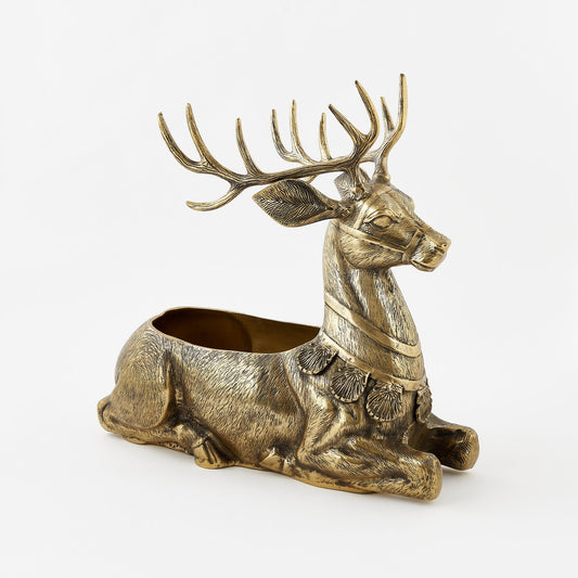 Bronze deer-shaped candle holder on a white background