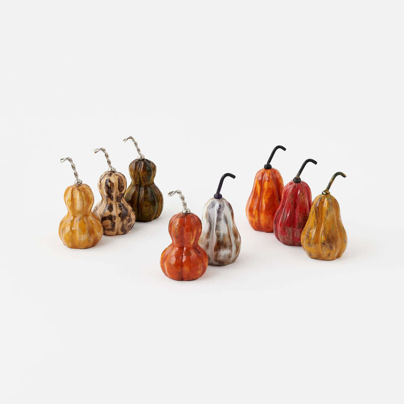 Wood Gourds, Set of 8 Assorted in various fall tones and shapes, topped with curled metal stems.