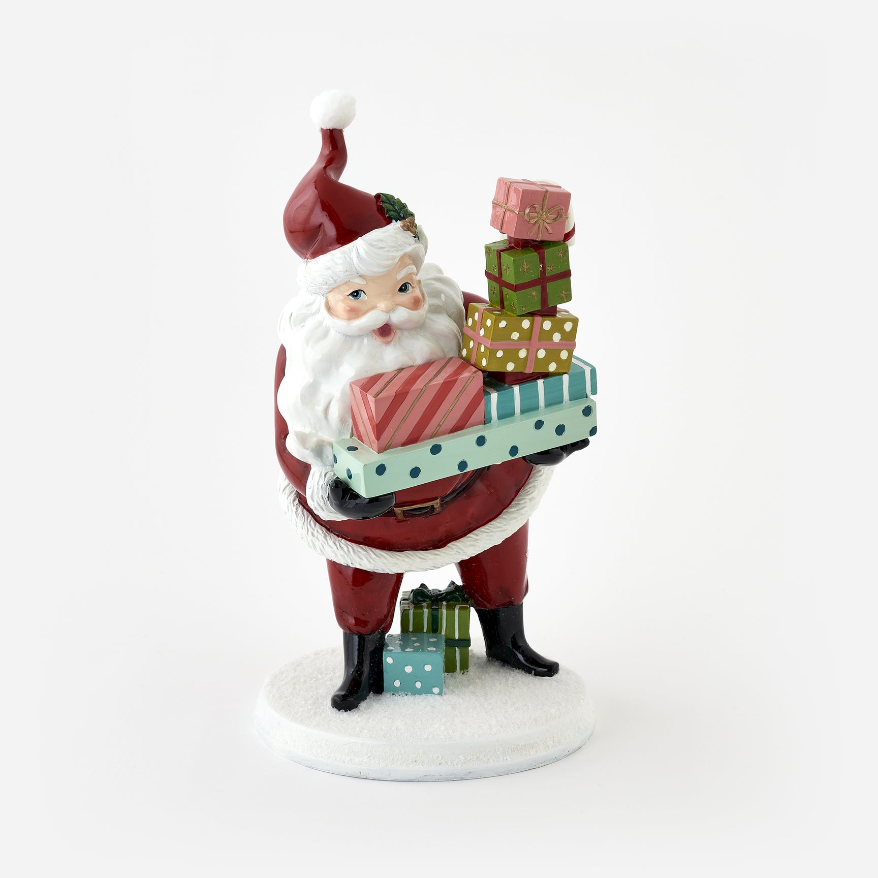 Decorative figurine of Santa Claus holding gifts on a white background