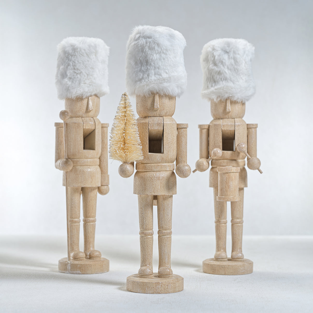 Resin Nutcrackers with White Fur Hats - Set of Three