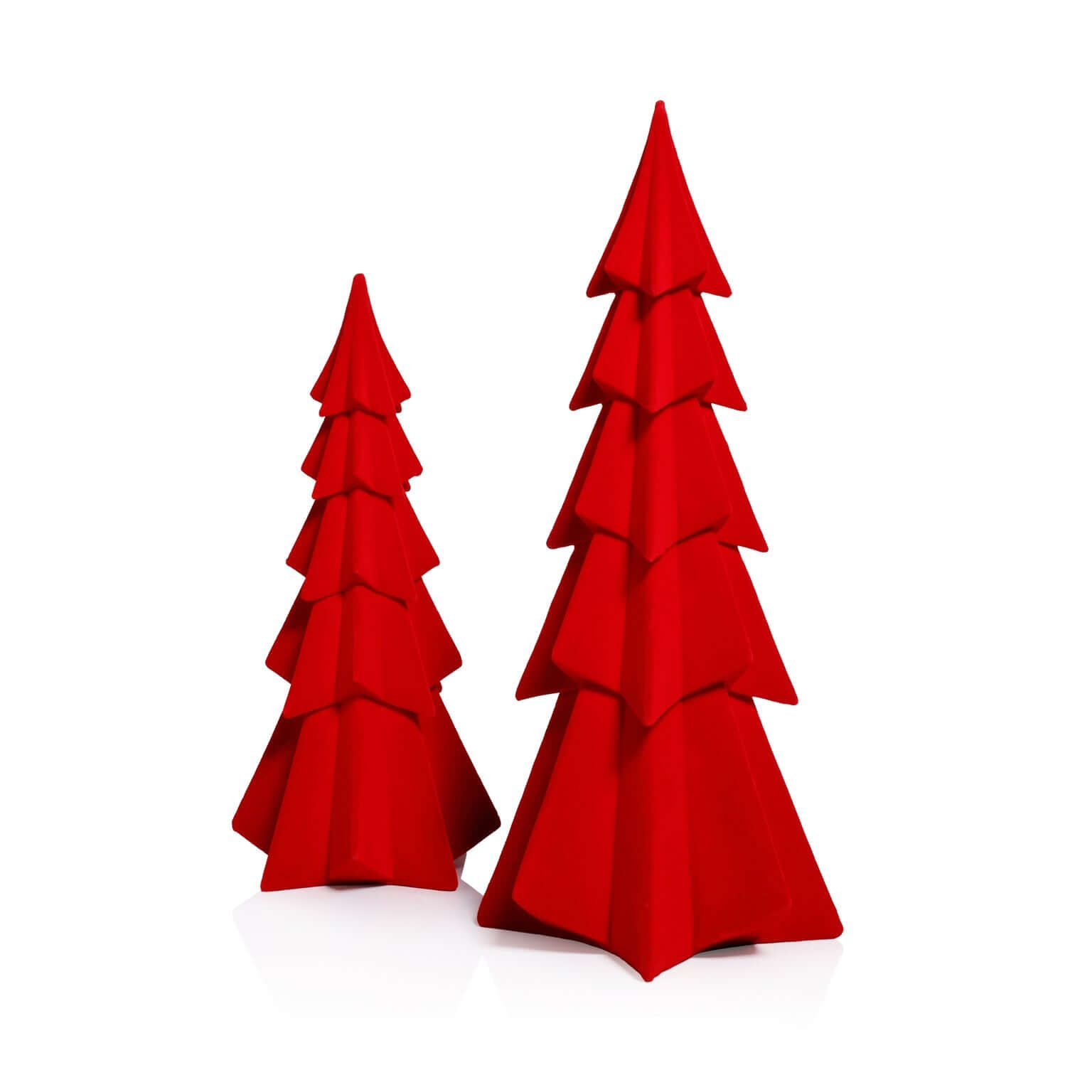 Two red paper Christmas trees on a white background