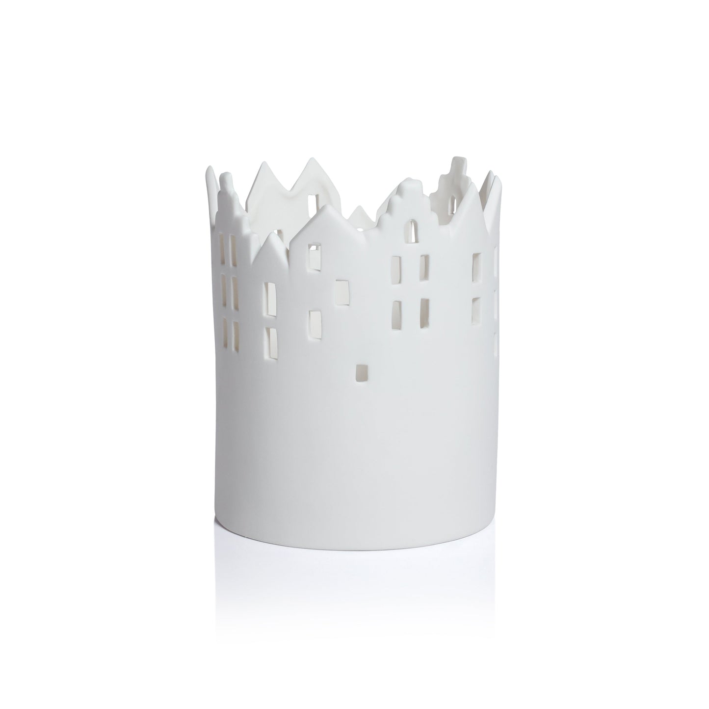 White decorative candle holder with cut-out design on a white background