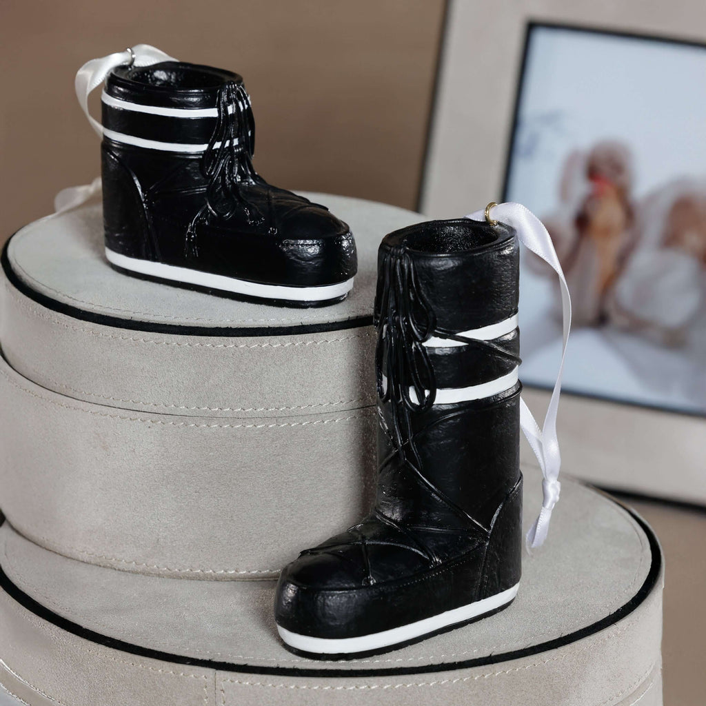 Après Ski Boots, Set of 6 Assorted black ornament displayed on elegant round boxes.