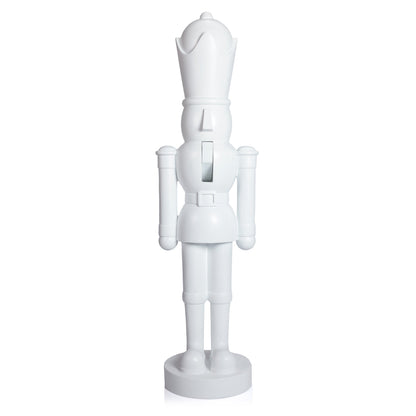 White nutcracker figurine on a white background