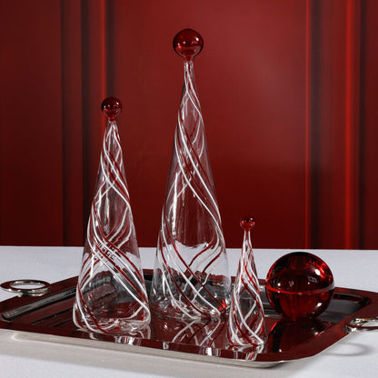 Decorative glass pieces on a tray with a red background
