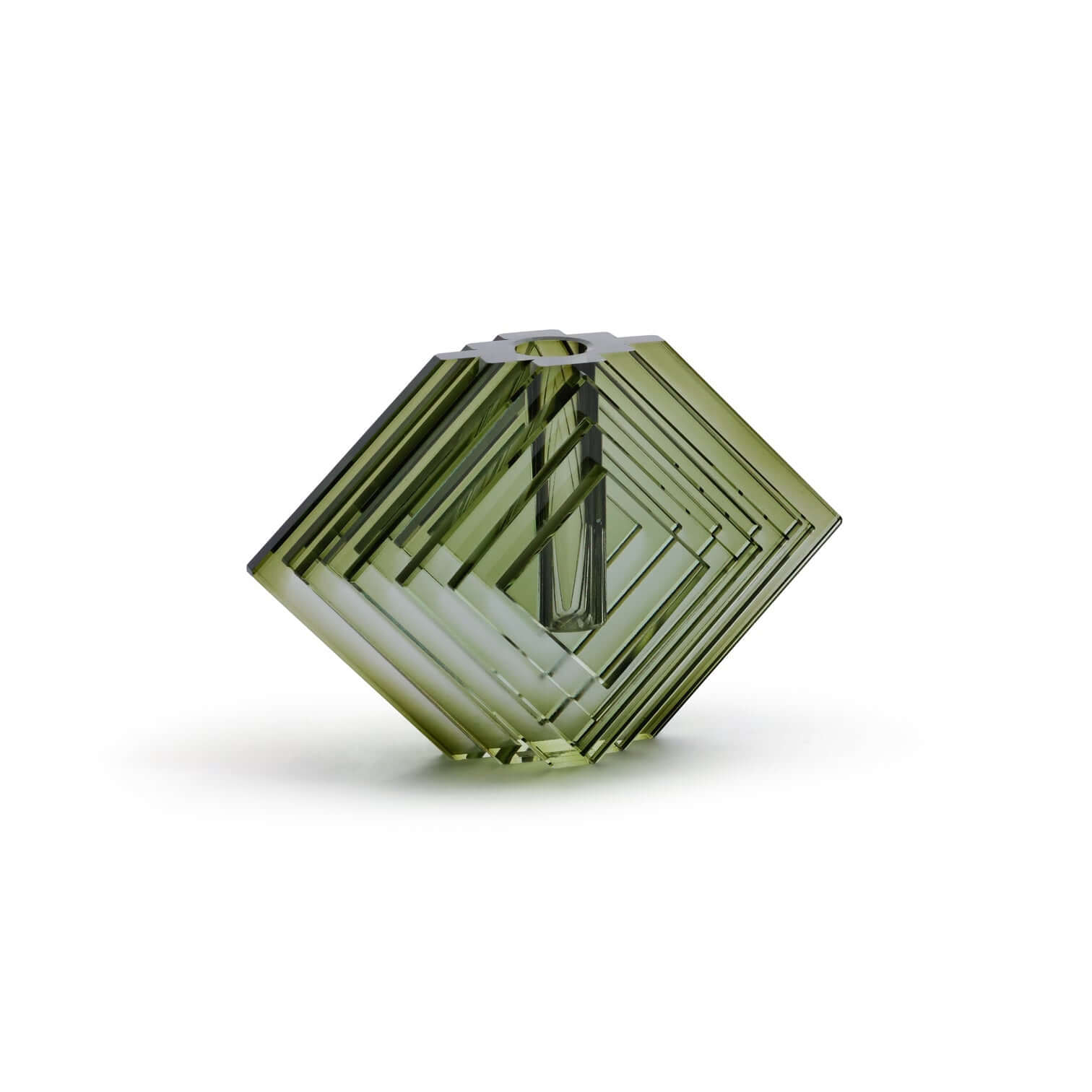 Green geometric crystal on a white background