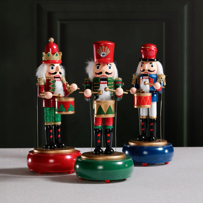 Three colorful nutcracker figurines on a gray surface with a dark background