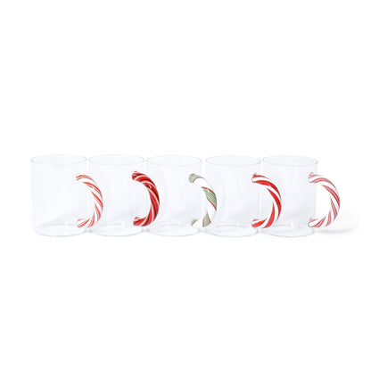 Set of four white mugs with red and green designs on a white background