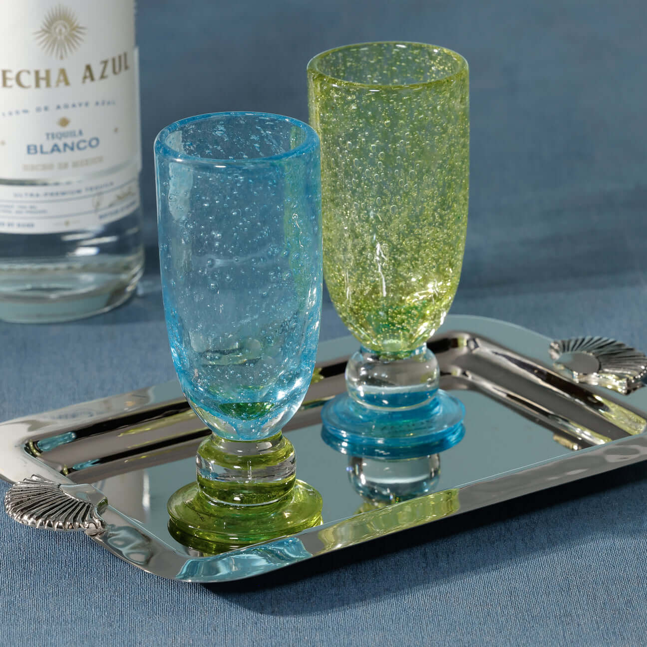 Antibes Mimosa / Bellini Glass, Set of 4 displayed on a silver tray with colorful, mouth-blown glass design.