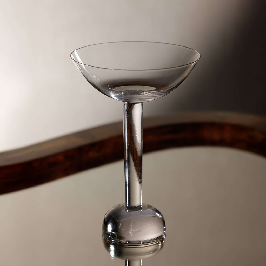Elegant cocktail glass from the Madrid Glassware Collection showcasing a sculptural sphere base.