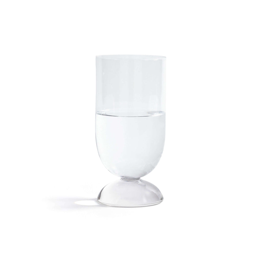 Madrid Glassware Collection clear glass with solid sphere base holding water on white background.