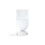 Madrid Glassware Collection clear glass with solid sphere base holding water on white background.