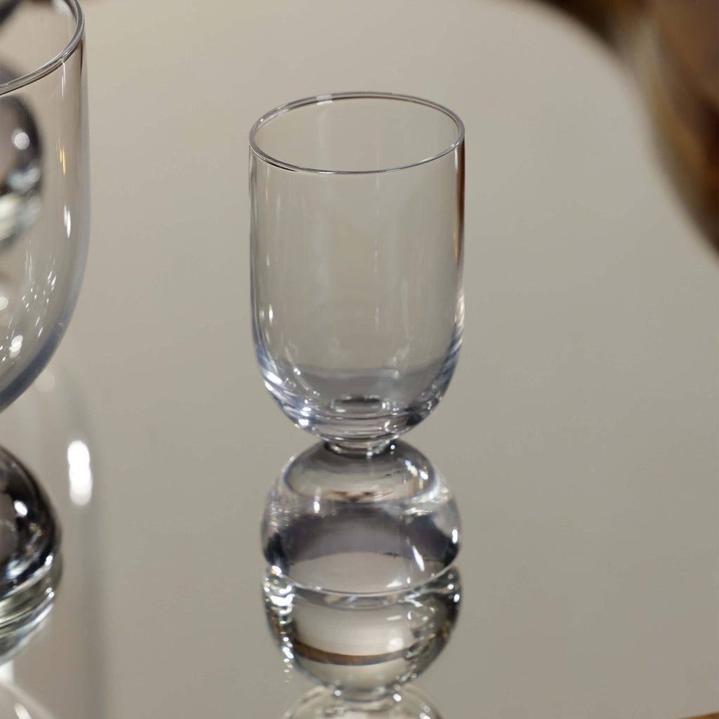 Madrid Glassware Collection: elegant glass design with a solid sphere base, enhancing any drink presentation.