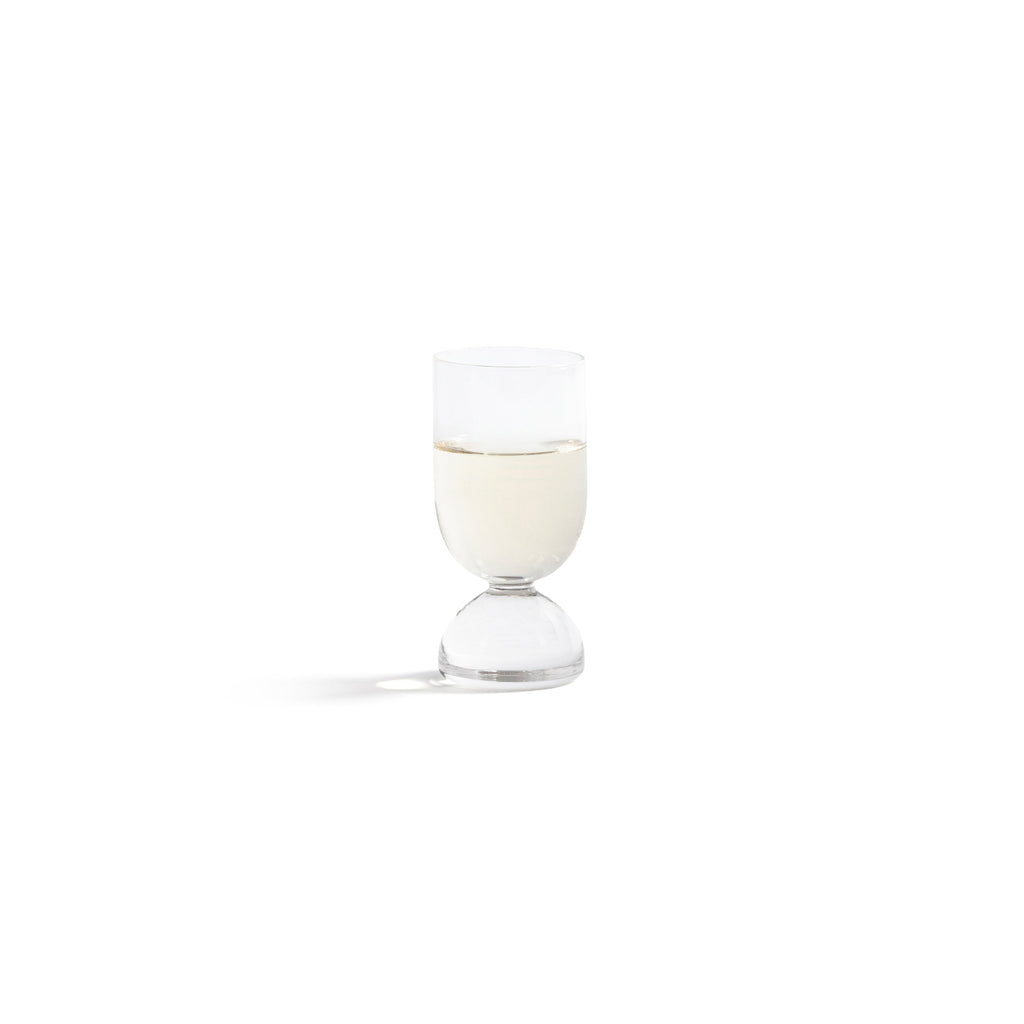 Madrid Glassware Collection featuring a sculptural glass with a solid sphere base and refined design.
