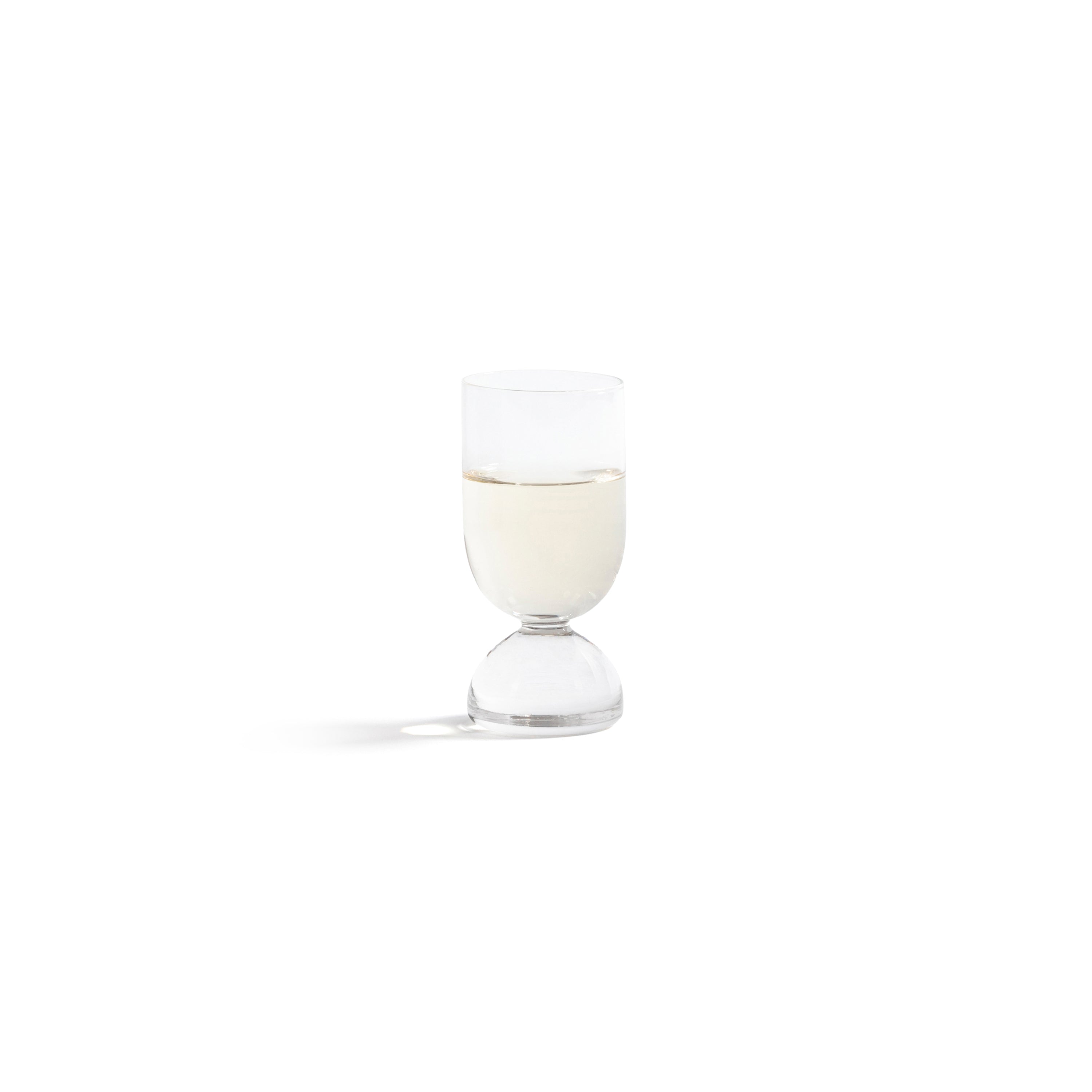 Madrid Glassware Collection featuring a sculptural glass with a solid sphere base and refined design.