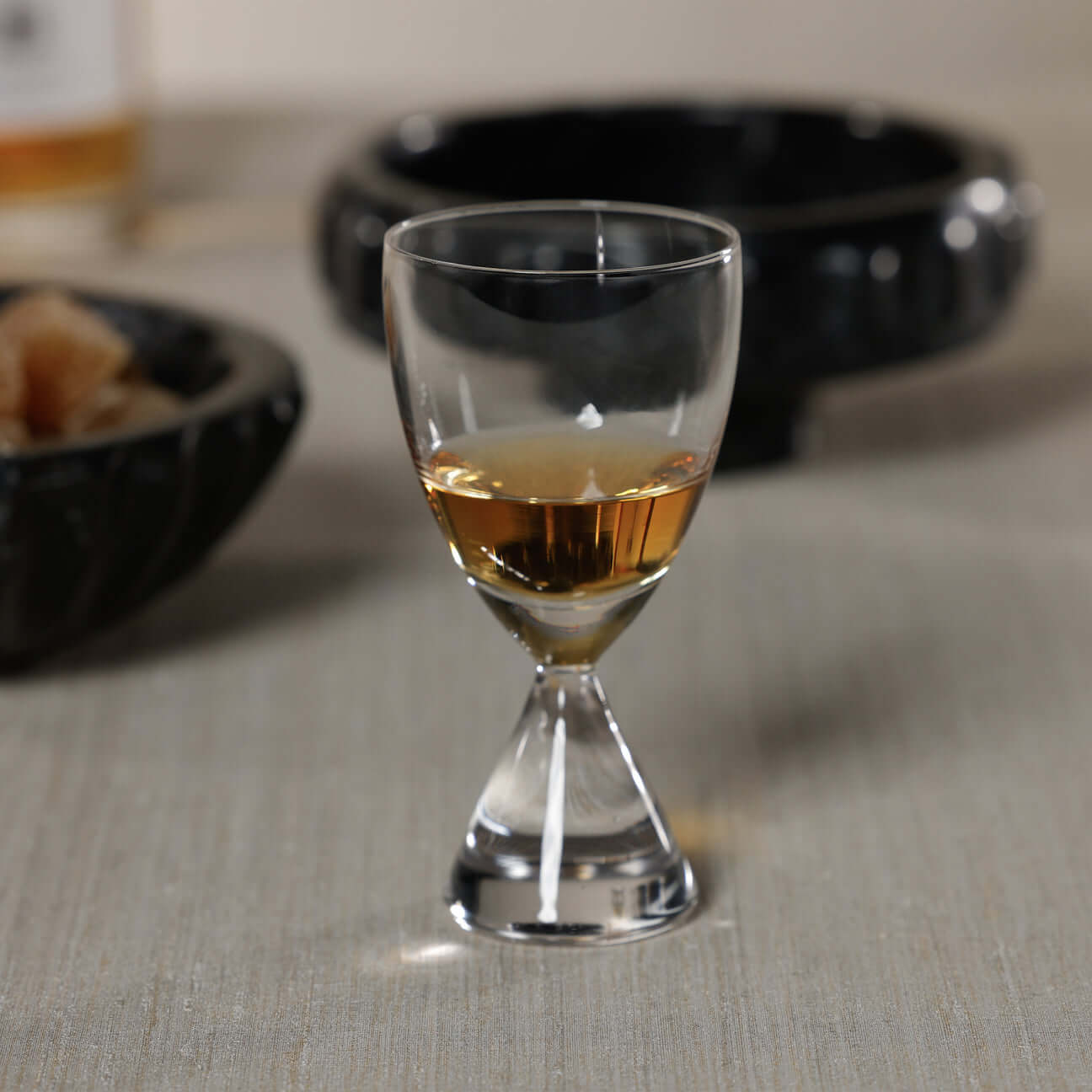Timeless Sip Shot Glass (Set of 6) featuring a flared bowl and clear glass showcasing amber liquor.