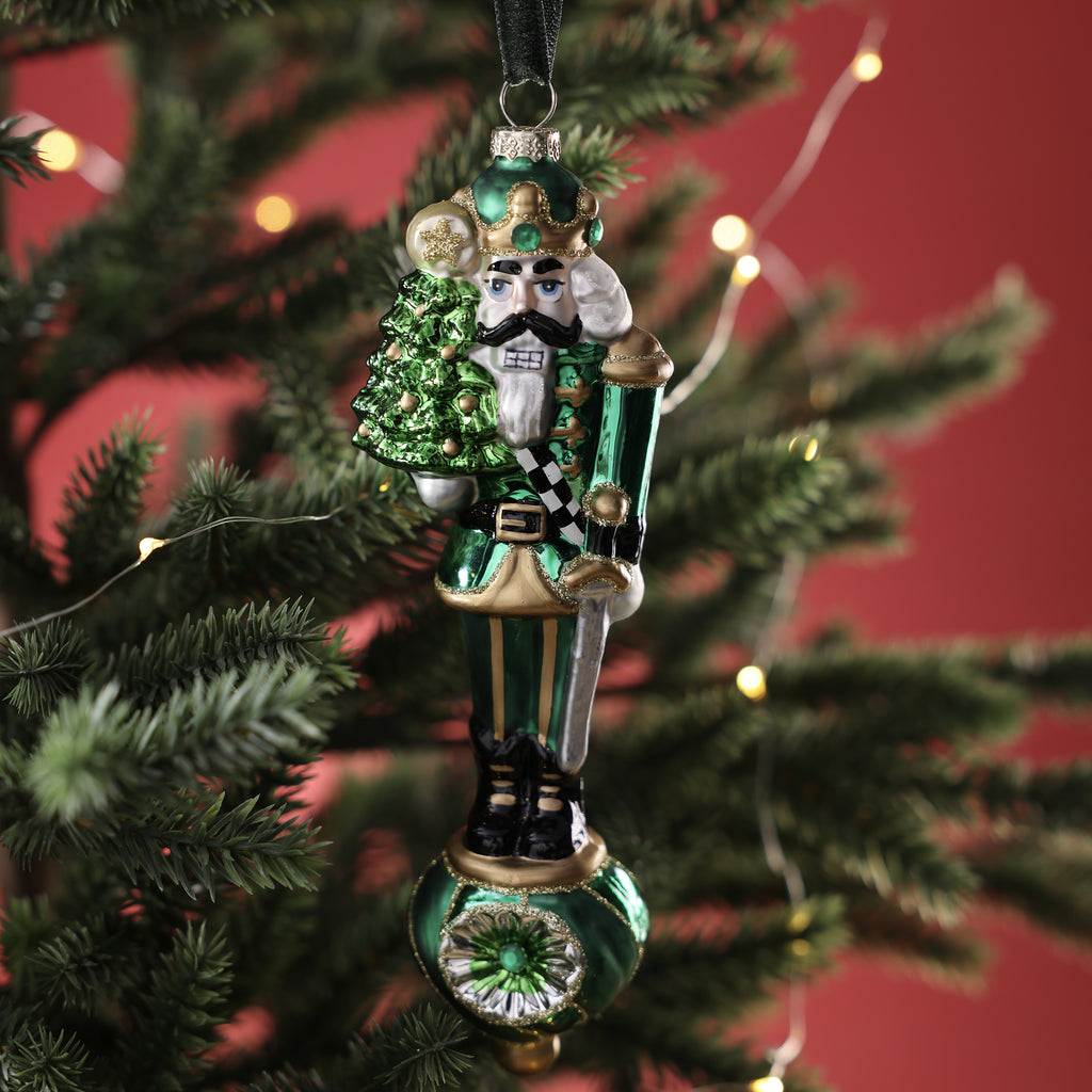 Holiday Soldier Holding Tree Glass Ornament