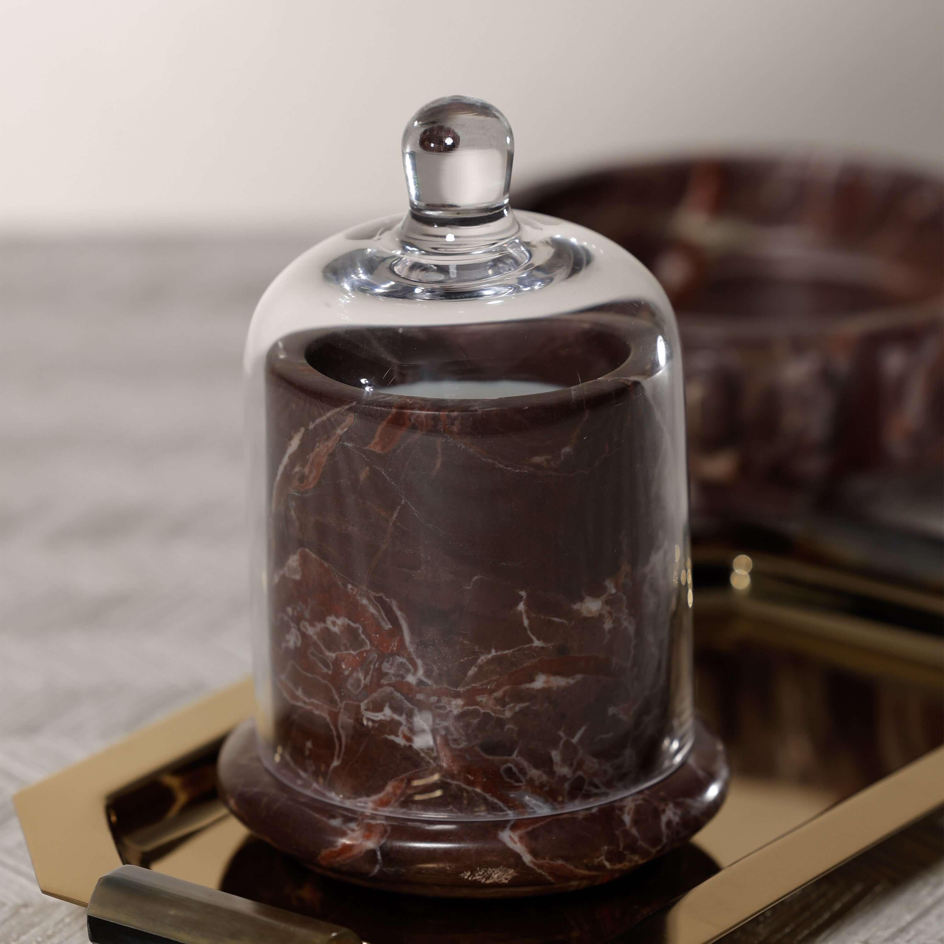 Marbella Scented Candle Jar with Cloche on a stylish tray with natural marble and hand-blown glass.