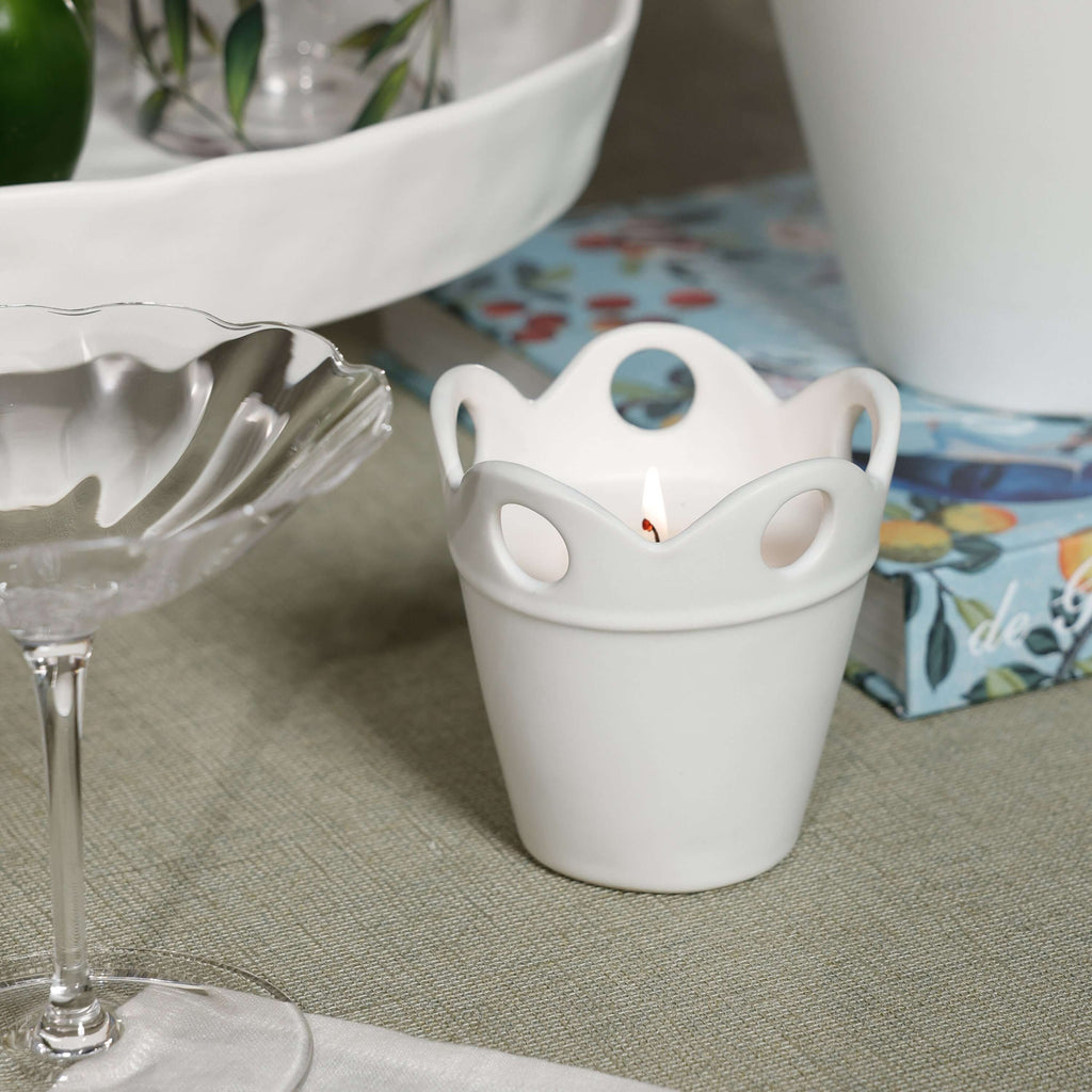 Stylish Citronella Pot Candle in white ceramic, featuring a scalloped rim and decorative cut-outs.