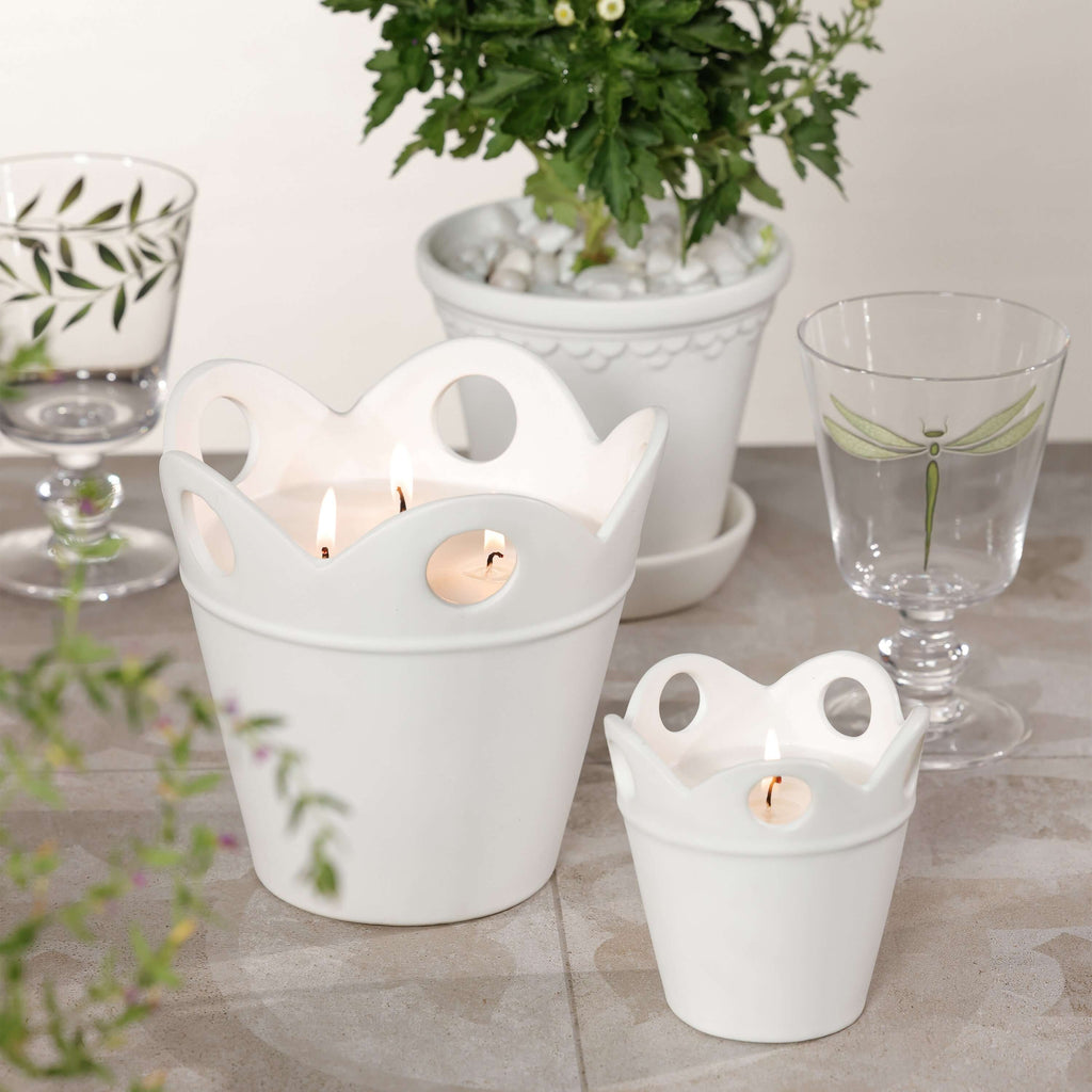 Citronella Pot Candle in white ceramic with scalloped rim and decorative cut-outs, ideal for outdoor use.