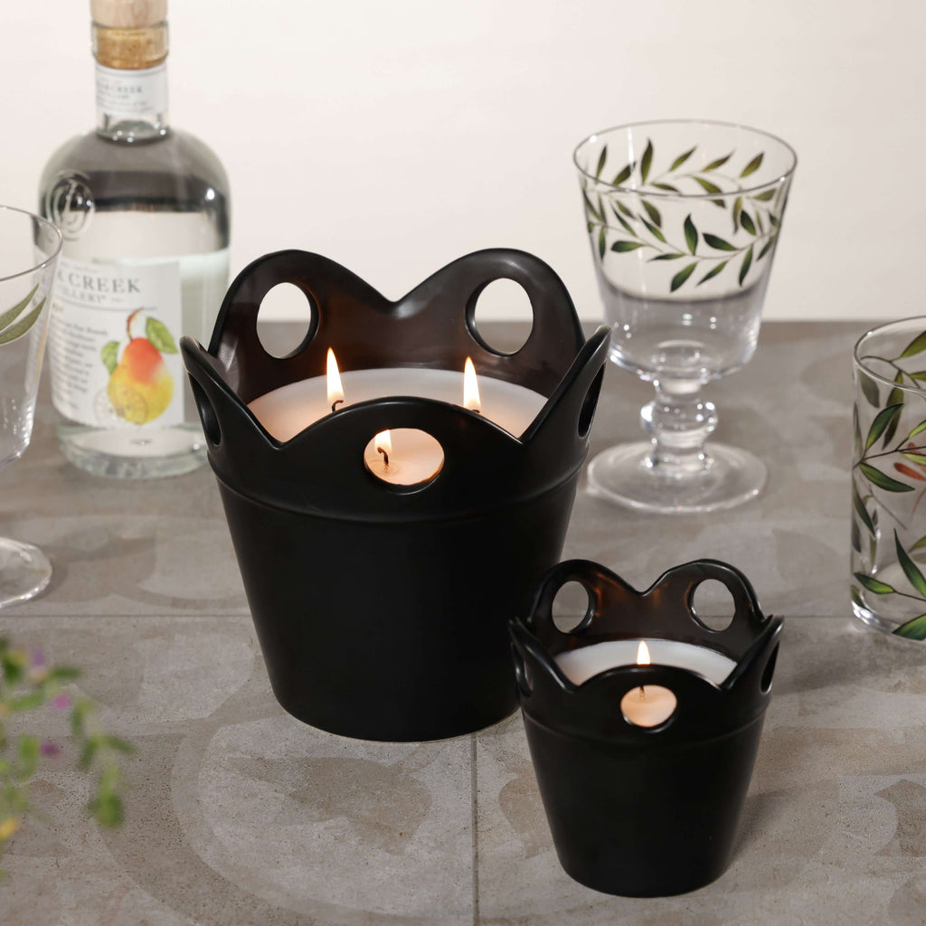 Citronella Pot Candle in elegant black ceramic, offering a stylish addition to outdoor decor.
